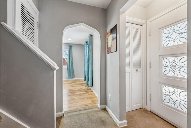 entrance foyer with light carpet