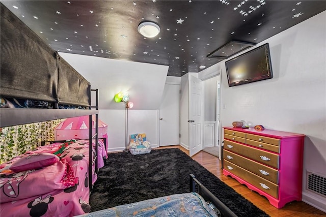 bedroom featuring hardwood / wood-style floors