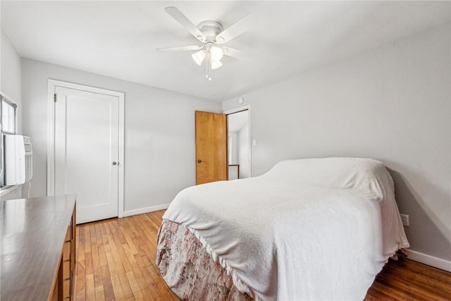 bedroom featuring ceiling fan and dark hardwood / wood-style flooring