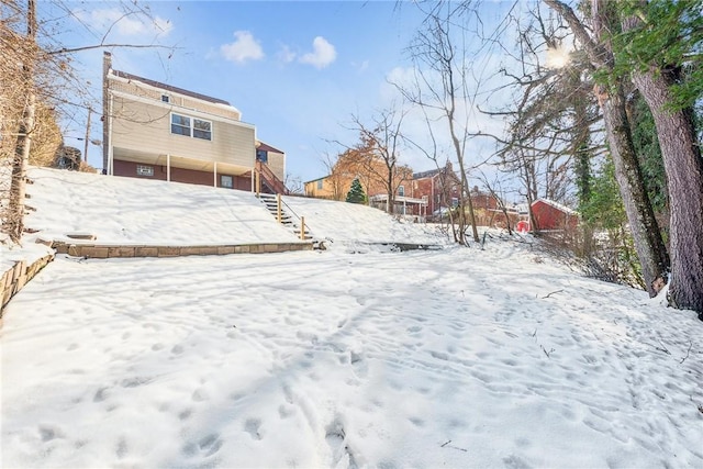 view of yard covered in snow