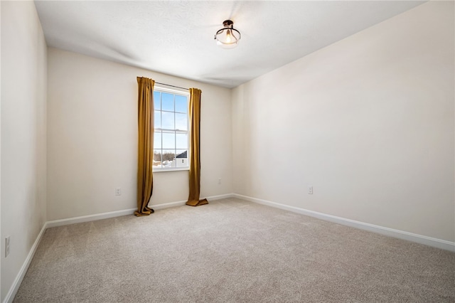 spare room featuring carpet floors