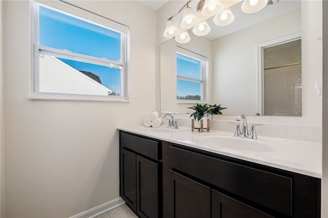 bathroom with tile patterned floors and vanity