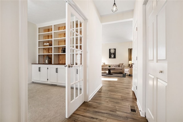 corridor featuring french doors and hardwood / wood-style flooring