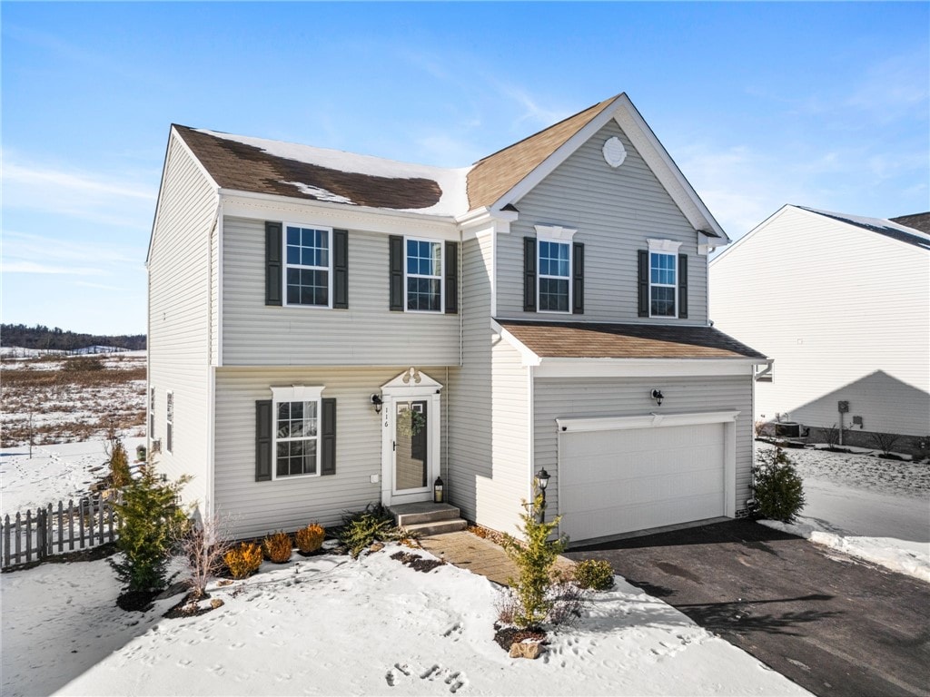 view of front of home with a garage