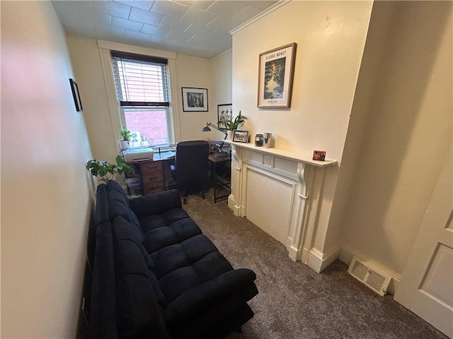 carpeted home office featuring visible vents and ornamental molding