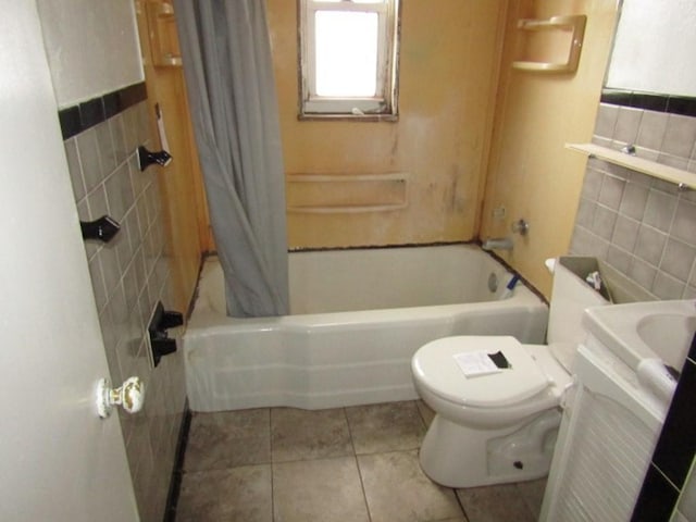 full bathroom featuring tile walls, tile patterned flooring, toilet, and vanity