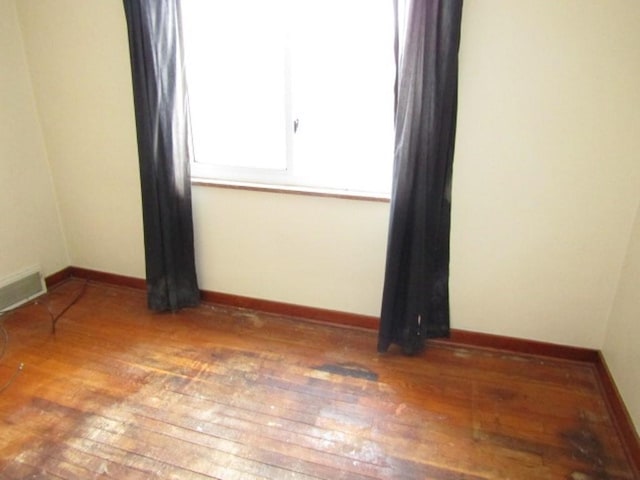 empty room featuring hardwood / wood-style flooring