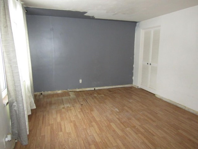 unfurnished room featuring light wood-type flooring