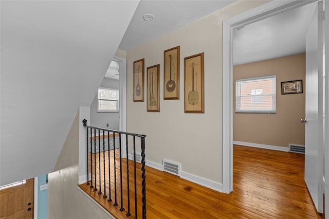 stairs featuring wood-type flooring