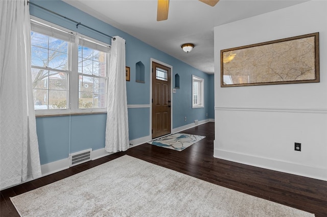 foyer entrance featuring dark hardwood / wood-style flooring and ceiling fan