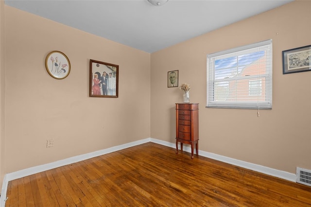 unfurnished room featuring wood-type flooring