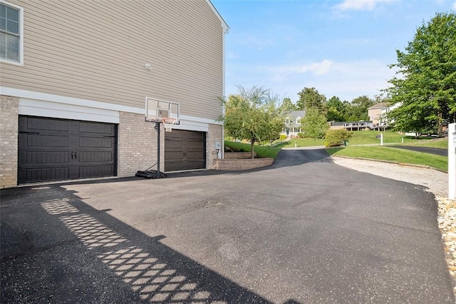 exterior space with a garage and a yard