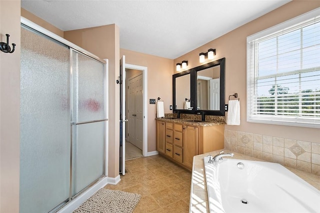 bathroom featuring independent shower and bath and vanity