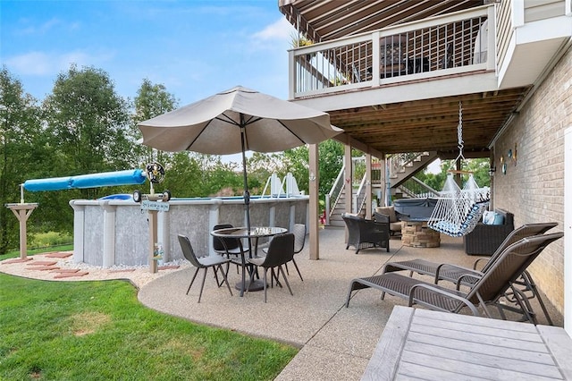 view of patio with a fire pit