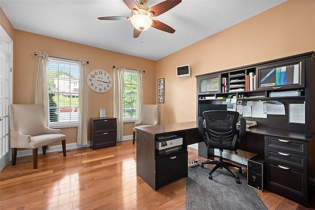 office area featuring lofted ceiling, ceiling fan, and light hardwood / wood-style floors