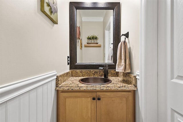 bathroom featuring vanity and crown molding