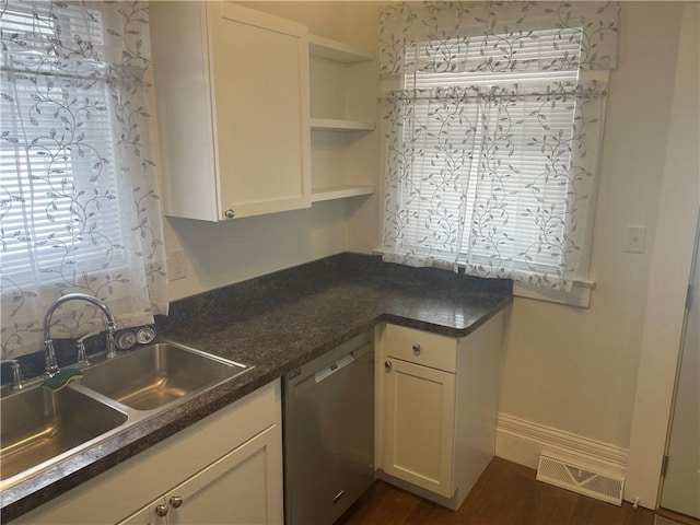 kitchen featuring visible vents, a sink, open shelves, stainless steel dishwasher, and white cabinets