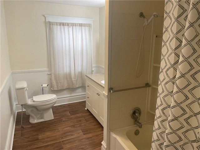 full bath featuring vanity, toilet, wood finished floors, and shower / bath combo with shower curtain