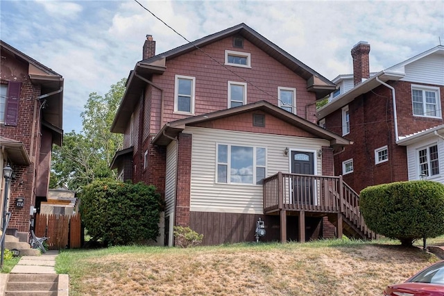 rear view of house with a lawn