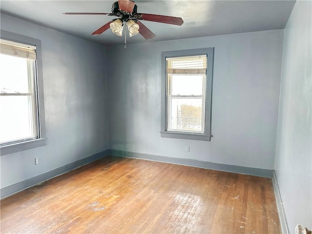 unfurnished room featuring ceiling fan and light hardwood / wood-style floors