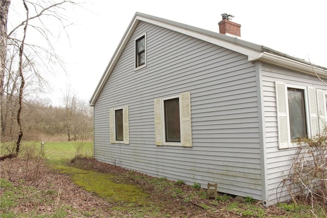 567 Klein Rd, Mill Creek, PA 16145 - view of home's exterior with a chimney