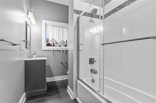 bathroom with enclosed tub / shower combo, tile patterned floors, and vanity