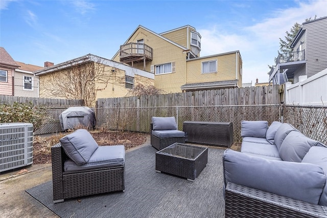 view of patio / terrace featuring area for grilling, central air condition unit, and an outdoor living space