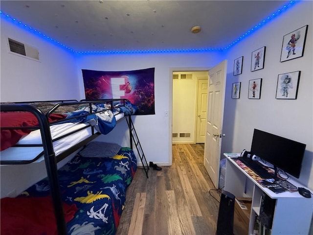 bedroom featuring hardwood / wood-style flooring