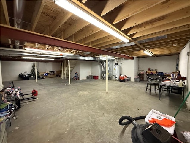 basement featuring water heater and heating unit