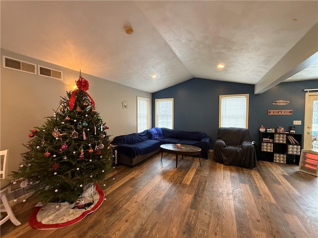 living room with dark hardwood / wood-style flooring and lofted ceiling