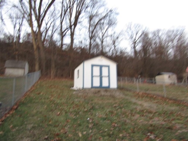 view of outbuilding with a lawn