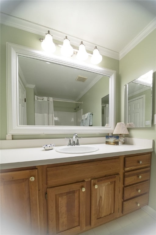 bathroom featuring crown molding, a shower with shower curtain, and vanity