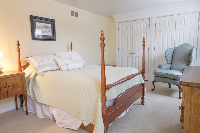 carpeted bedroom with multiple closets