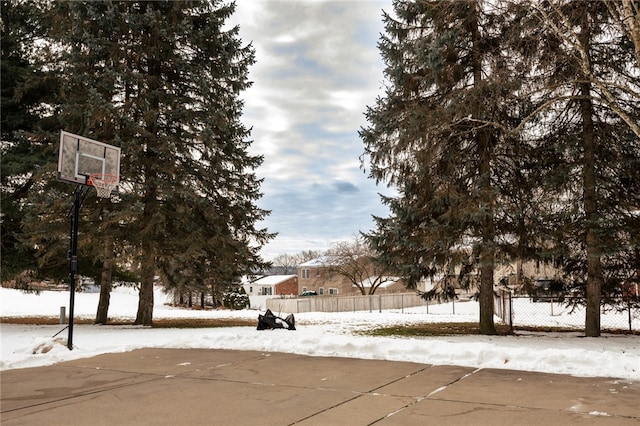 yard covered in snow with basketball hoop