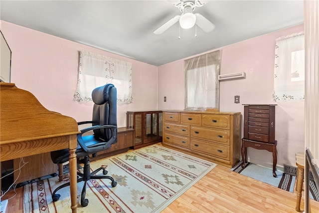 office featuring ceiling fan and light hardwood / wood-style floors