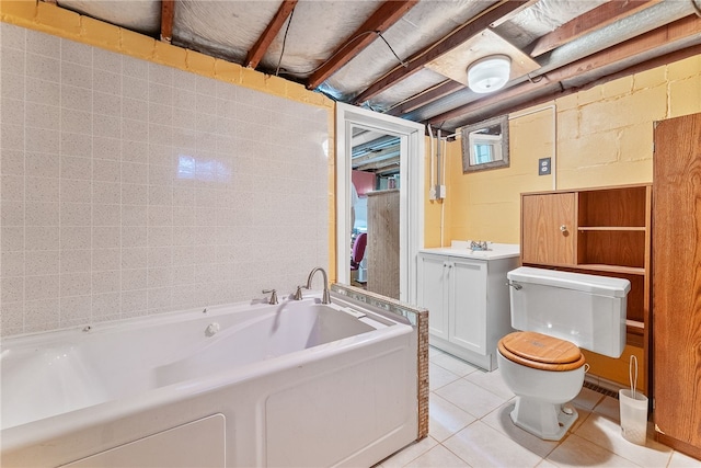 bathroom with toilet, a bathing tub, tile patterned floors, and vanity