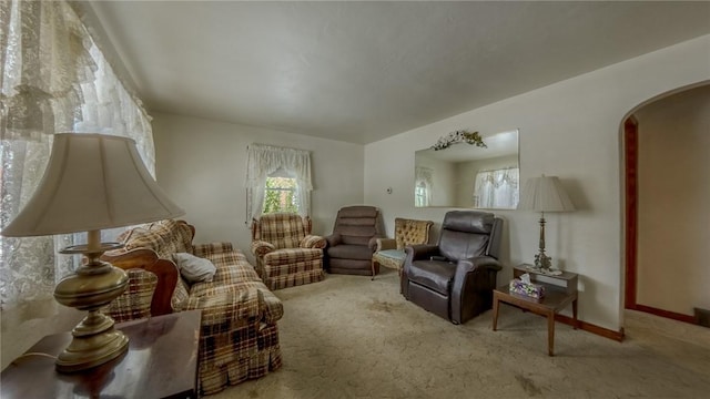 living area with light carpet