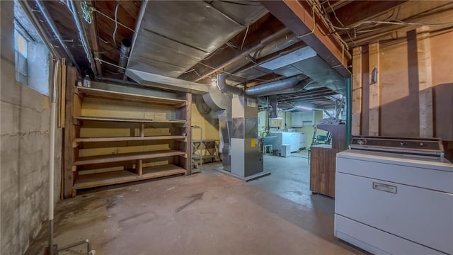 basement with washer / dryer and heating unit