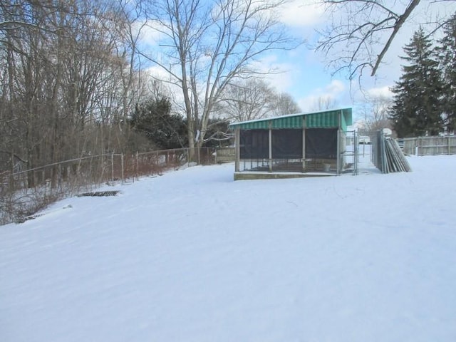 view of yard layered in snow