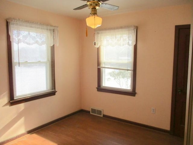 unfurnished room featuring ceiling fan and wood-type flooring