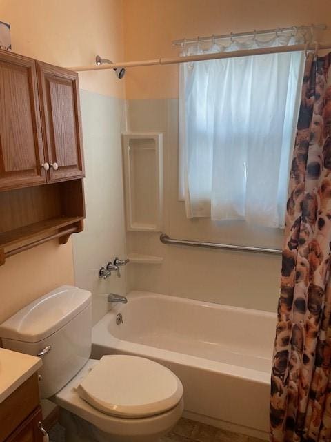 full bathroom featuring vanity, toilet, and shower / tub combo