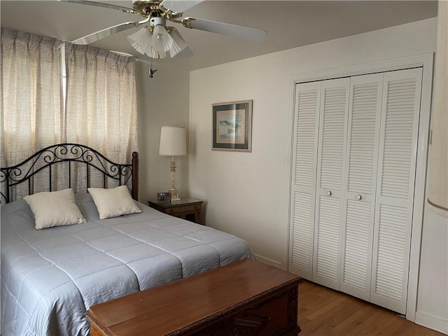 bedroom featuring a closet, ceiling fan, and hardwood / wood-style flooring