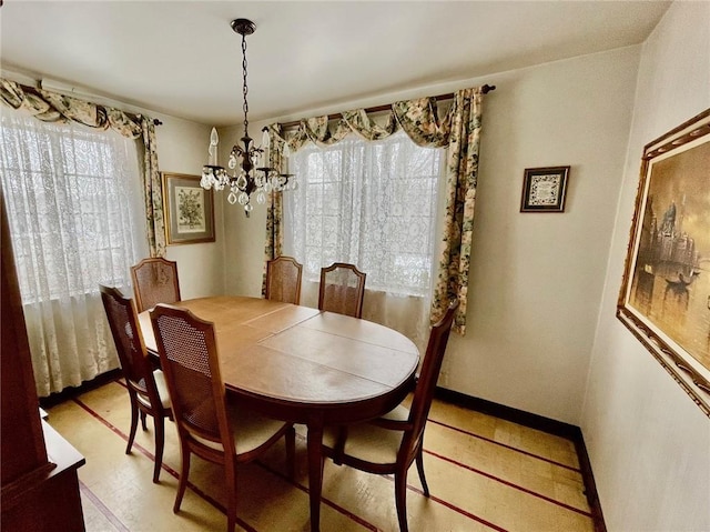 dining space with a notable chandelier