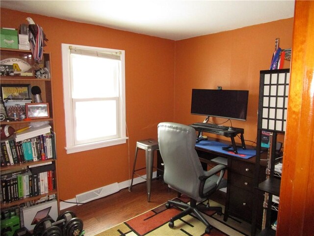 office area with hardwood / wood-style floors