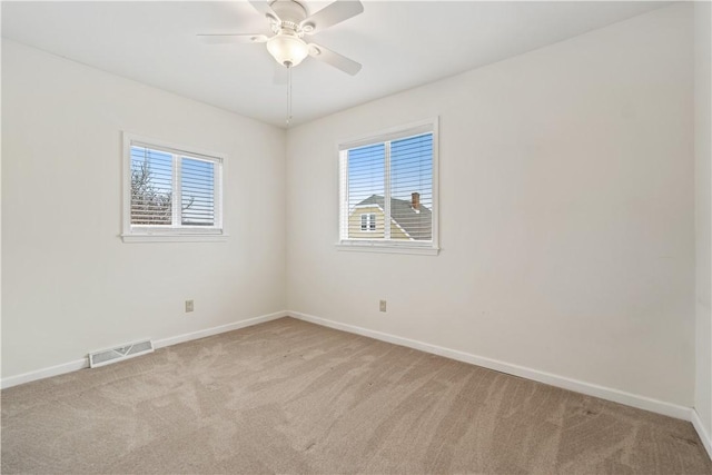 carpeted empty room with ceiling fan