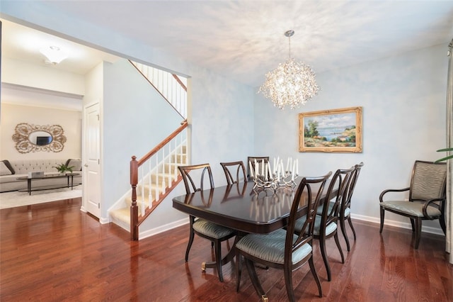 dining area featuring a notable chandelier and dark hardwood / wood-style floors