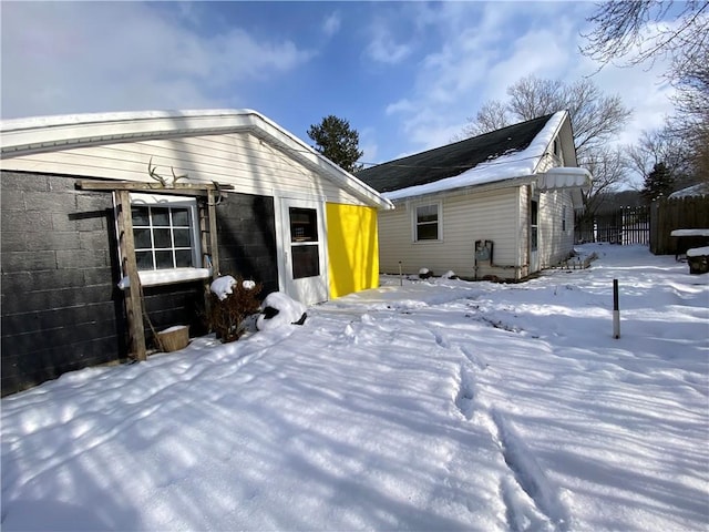 view of snow covered house