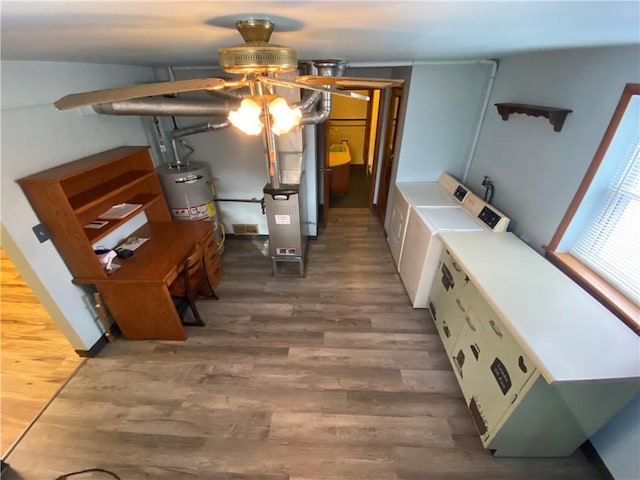 interior space with water heater and independent washer and dryer