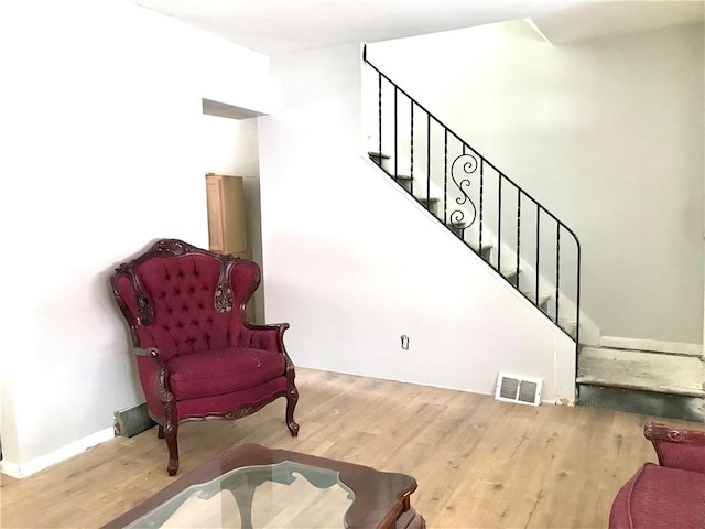 sitting room featuring wood-type flooring