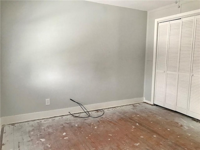 unfurnished bedroom with a closet